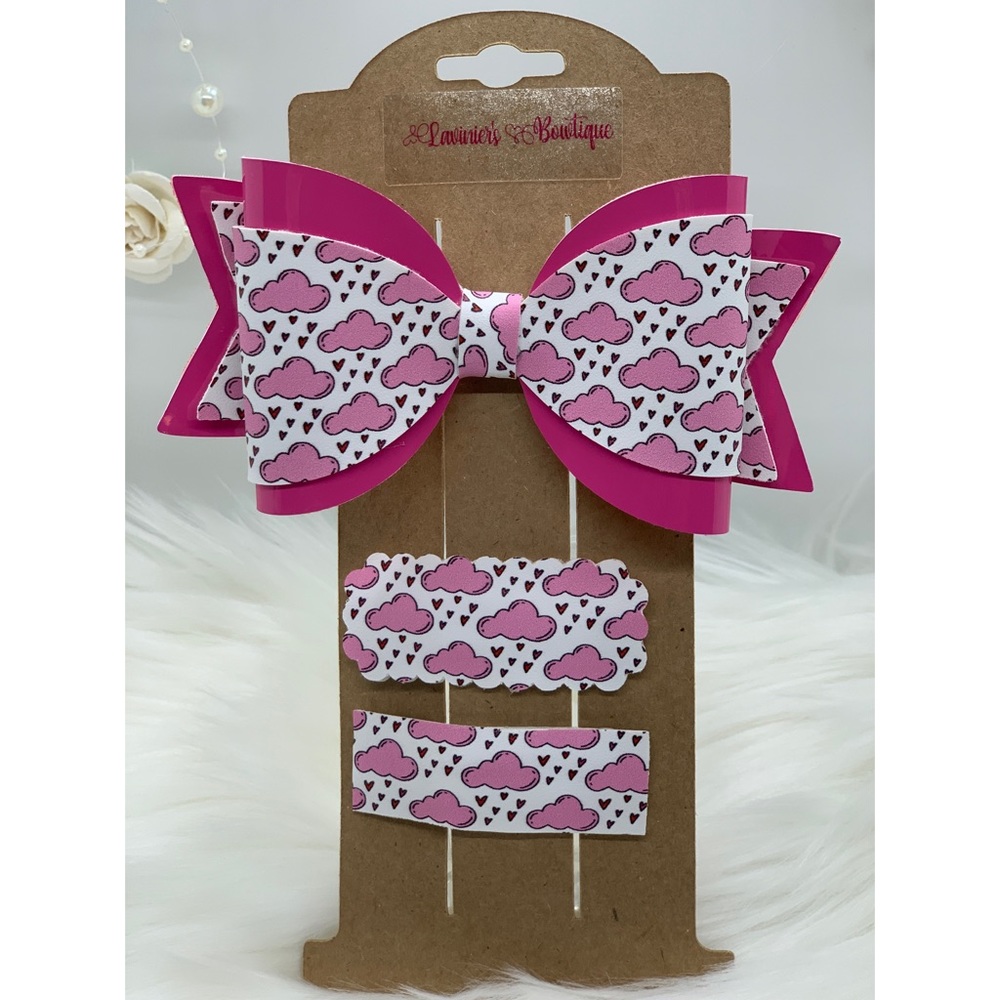Pink clouds print, and pink faux leather bow